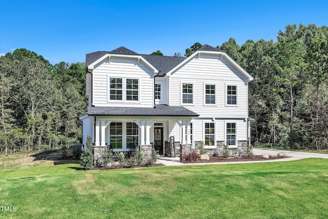 view of front of house with a front lawn and covered porch