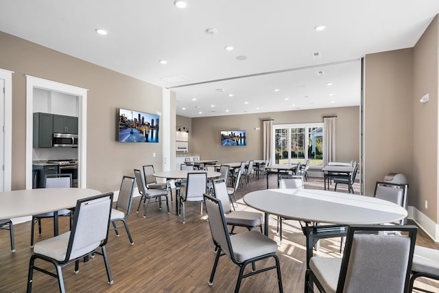 dining area featuring dark wood finished floors, recessed lighting, and baseboards