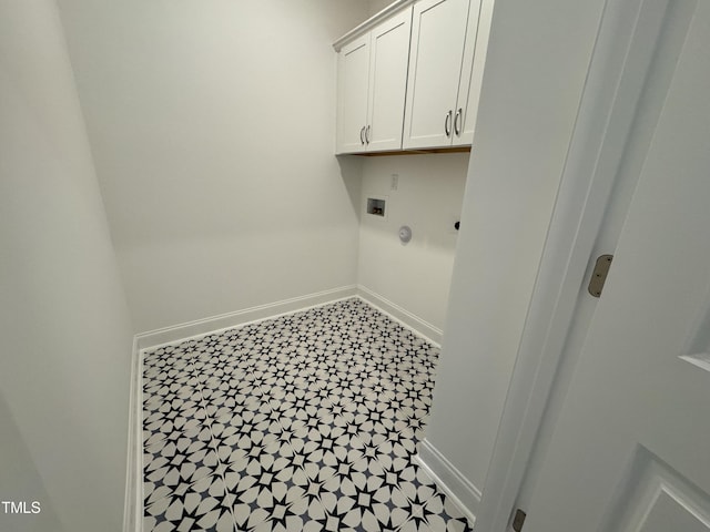 laundry area with electric dryer hookup, baseboards, cabinet space, and washer hookup