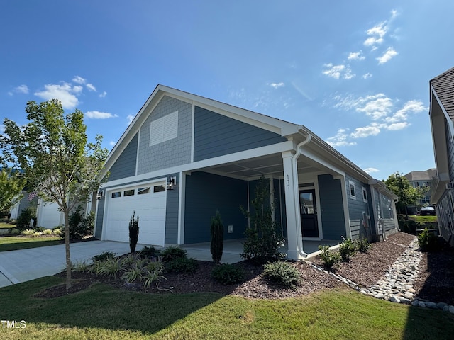 view of front of property featuring a garage and a front yard