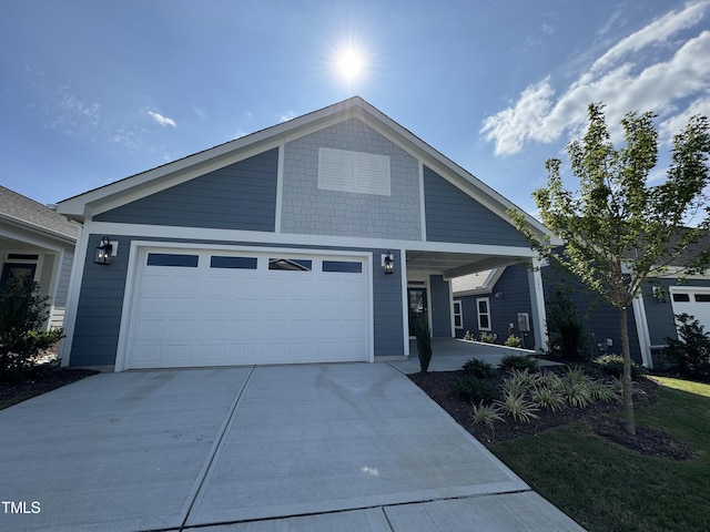 view of front of house featuring an attached garage and concrete driveway