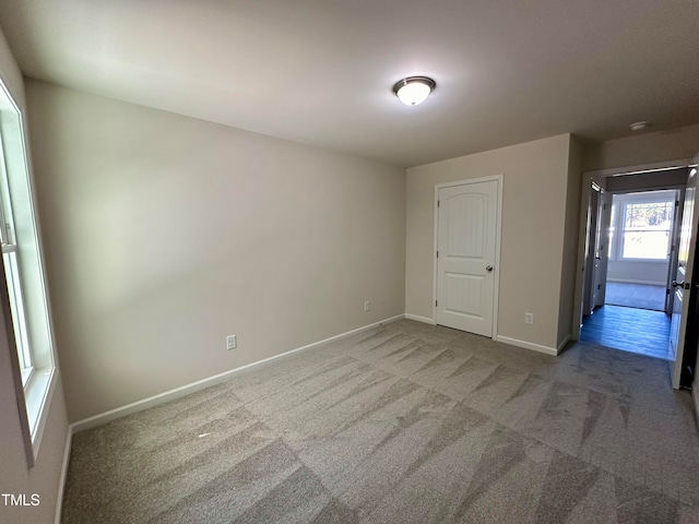 spare room featuring carpet floors