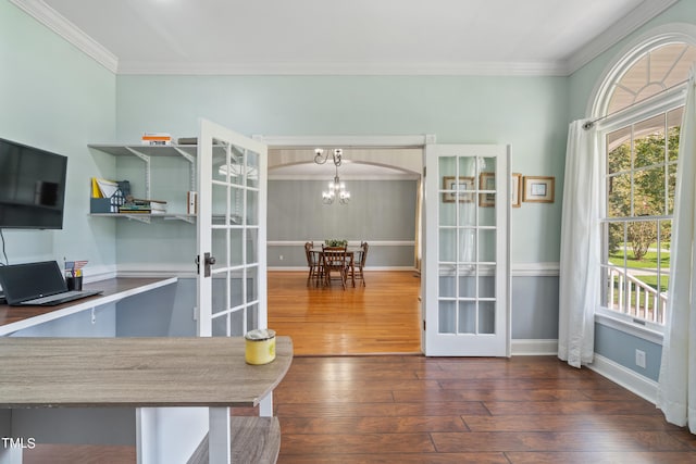 interior space with dark wood-style floors, french doors, crown molding, and a healthy amount of sunlight