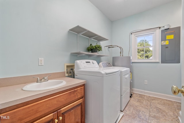 laundry room with a sink, baseboards, cabinet space, electric panel, and washing machine and clothes dryer