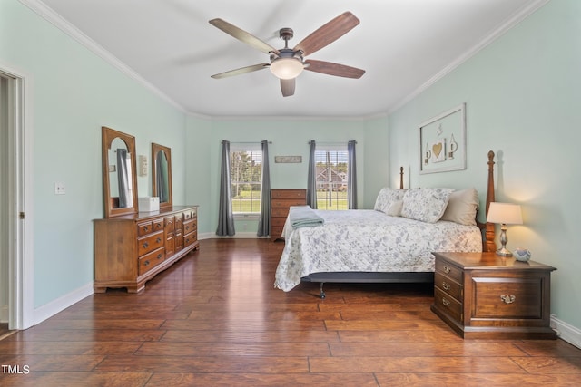 bedroom with ornamental molding, dark wood finished floors, and baseboards