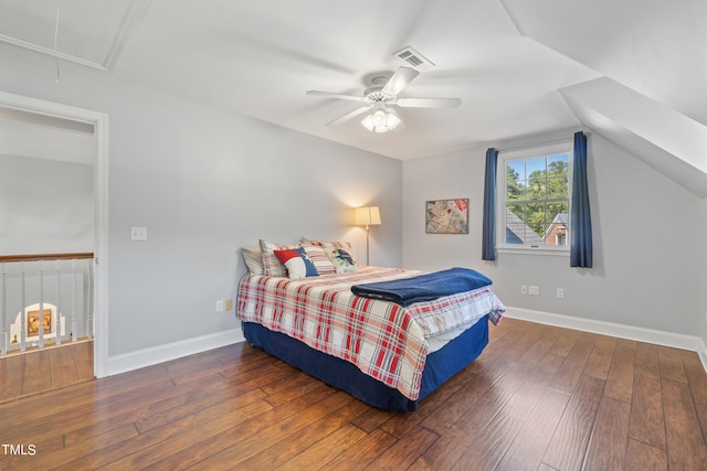 bedroom featuring baseboards, attic access, visible vents, and hardwood / wood-style floors