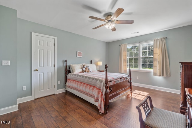 bedroom with ceiling fan, wood-type flooring, visible vents, and baseboards