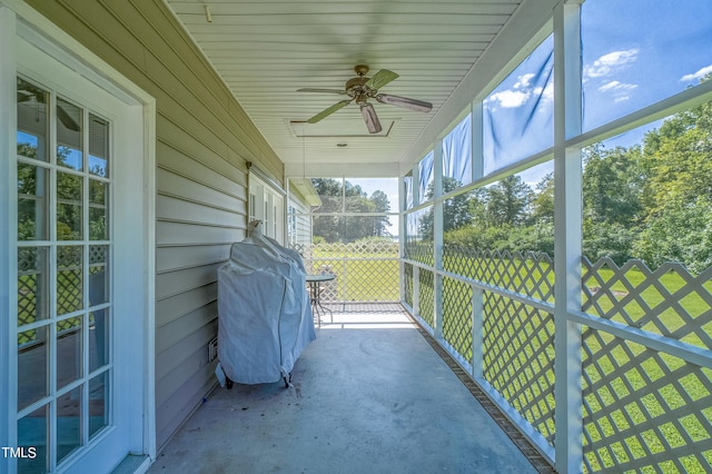 exterior space featuring a ceiling fan