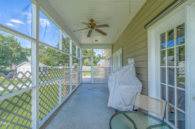 sunroom with a ceiling fan