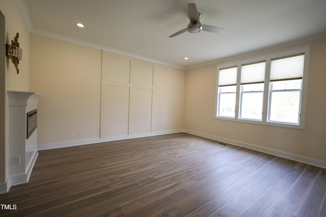 unfurnished living room featuring ceiling fan, hardwood / wood-style floors, and ornamental molding