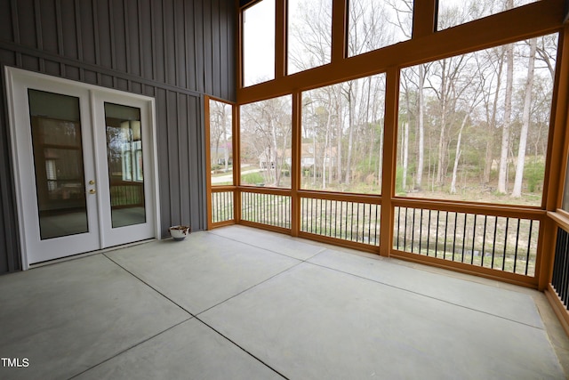 unfurnished sunroom featuring french doors and a healthy amount of sunlight