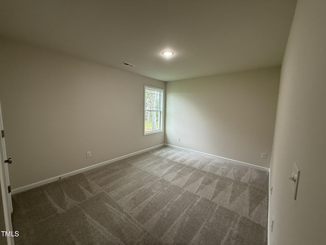 empty room featuring carpet flooring