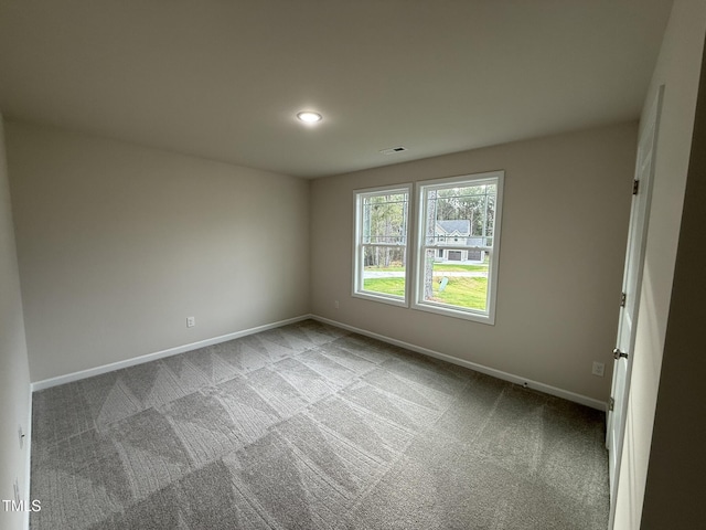 spare room with light colored carpet