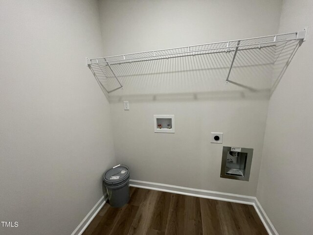 clothes washing area with electric dryer hookup, hookup for a washing machine, and dark wood-type flooring