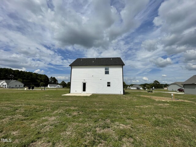 view of home's exterior with a yard