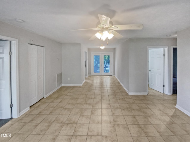 unfurnished room with french doors, a ceiling fan, visible vents, and baseboards