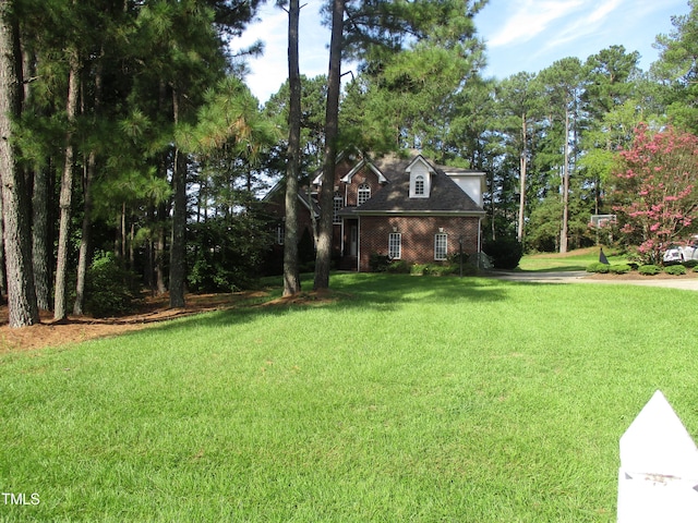 view of front of home with a front lawn