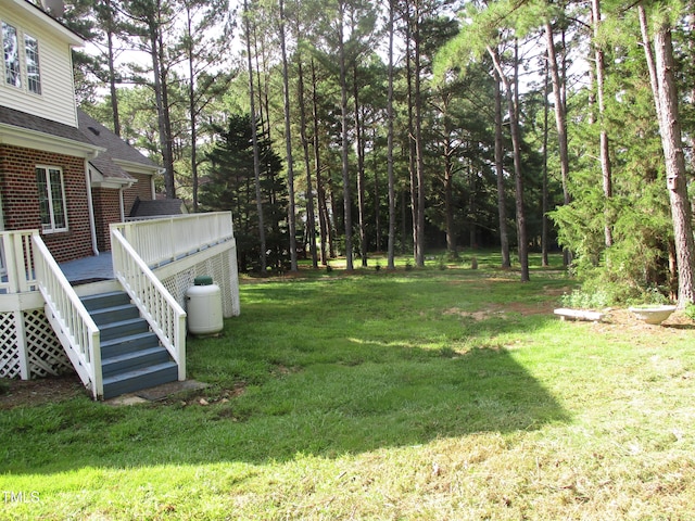 view of yard with a wooden deck