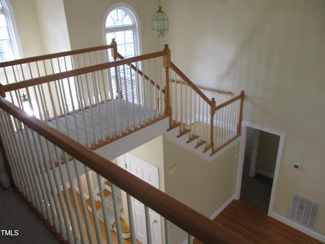 stairs with wood-type flooring