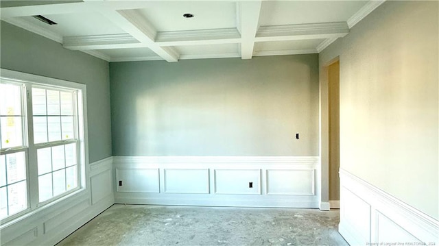 spare room with crown molding, beamed ceiling, and coffered ceiling