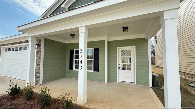 doorway to property featuring an attached garage