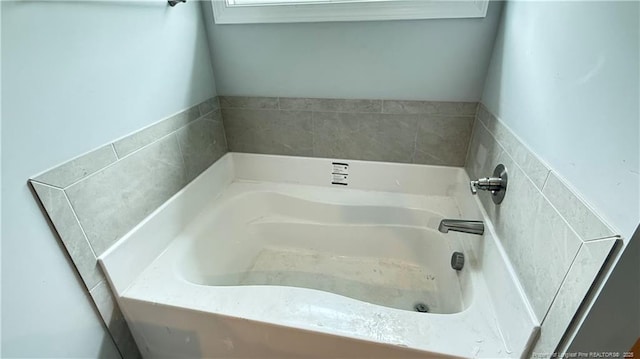 full bathroom featuring a garden tub