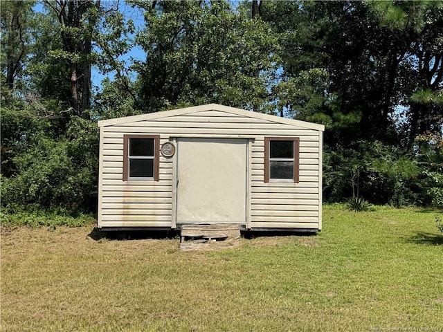 view of outdoor structure with a yard