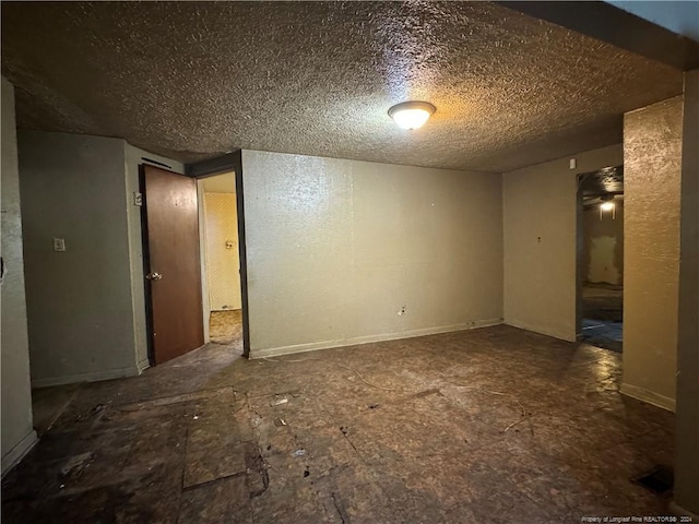 empty room with a textured ceiling