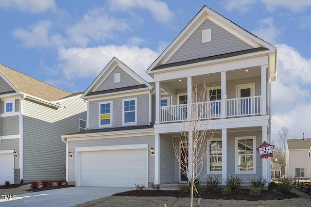 view of front of property with a balcony and a garage