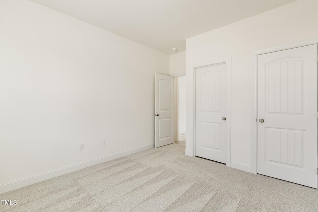 unfurnished bedroom with light carpet