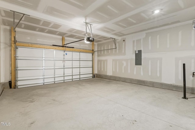 garage with a garage door opener and electric panel