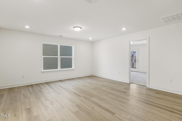 unfurnished room featuring light hardwood / wood-style floors