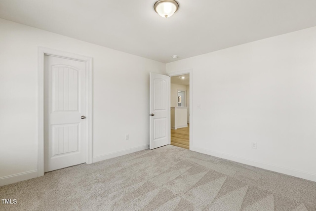 empty room featuring light carpet