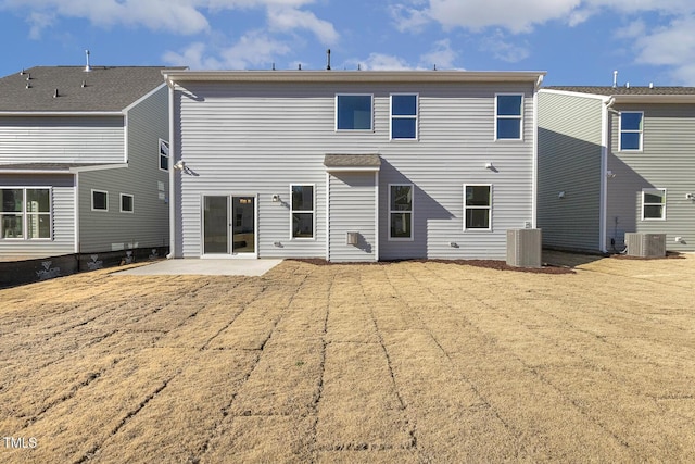 back of property with a patio and central AC unit