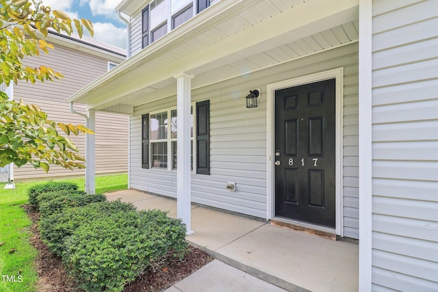 property entrance with covered porch