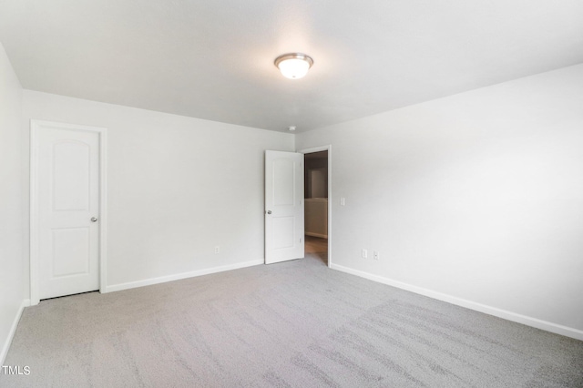 empty room featuring light colored carpet