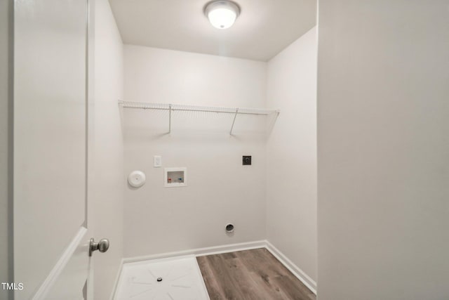 laundry area featuring gas dryer hookup, electric dryer hookup, washer hookup, and hardwood / wood-style flooring