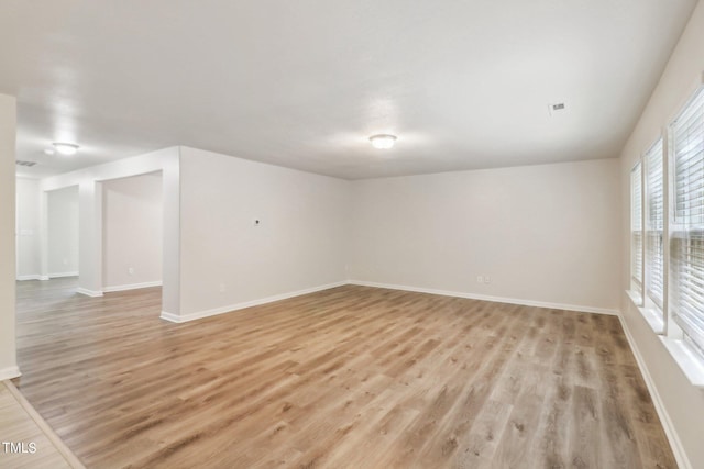 unfurnished room featuring light wood-type flooring