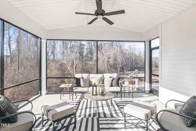 sunroom / solarium with vaulted ceiling and a ceiling fan