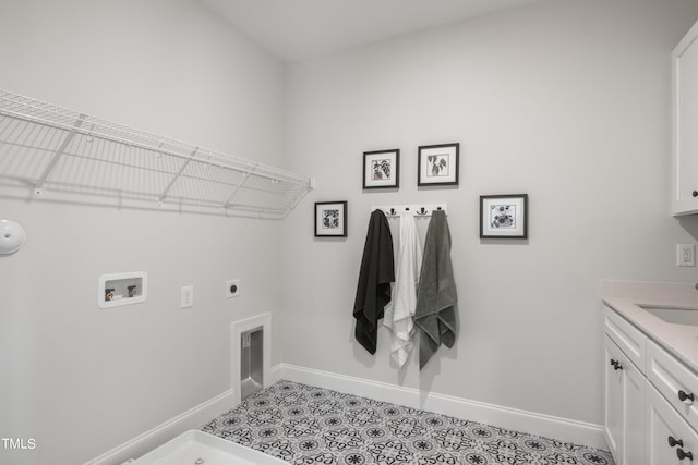 laundry area with light tile patterned flooring, hookup for a washing machine, baseboards, cabinet space, and electric dryer hookup