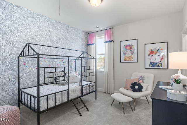 carpeted bedroom featuring visible vents and baseboards