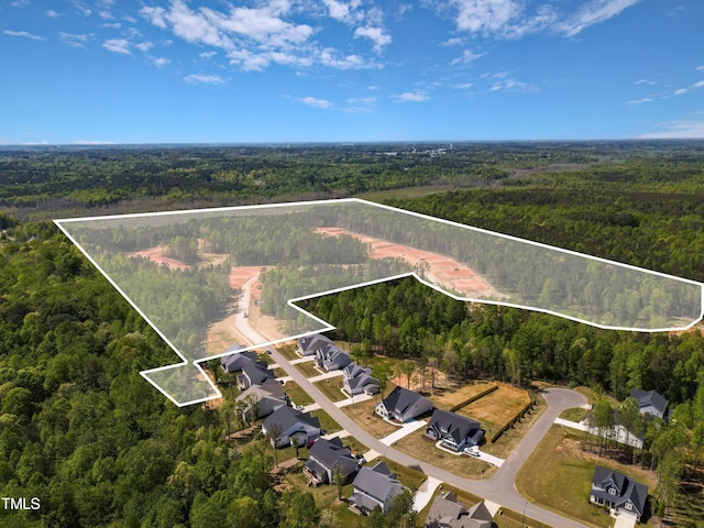 aerial view featuring a forest view