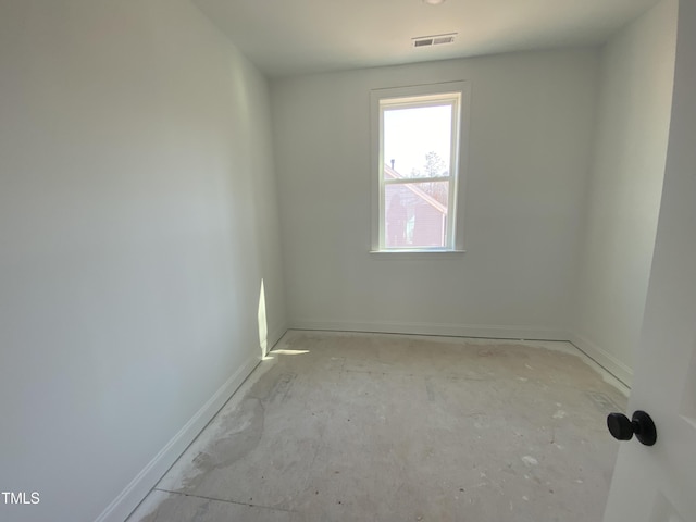 empty room with visible vents and baseboards