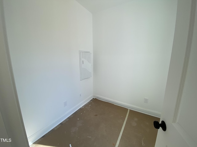 laundry area featuring baseboards