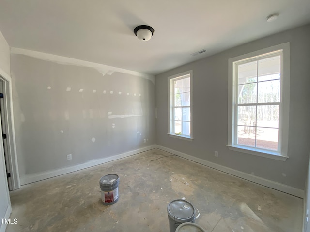 empty room featuring visible vents and baseboards