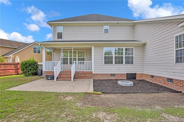 exterior space with a patio area, crawl space, covered porch, and a lawn