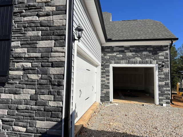 view of side of home with a garage