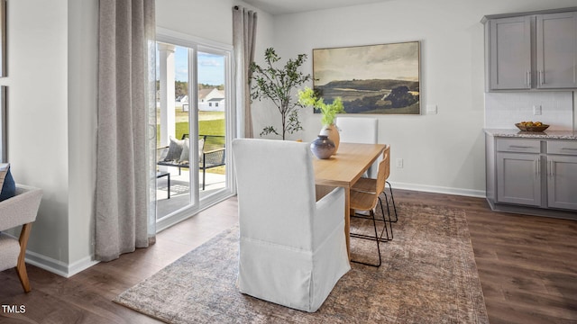 dining space featuring dark hardwood / wood-style flooring