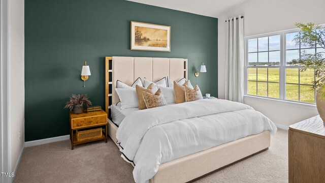 bedroom featuring carpet and multiple windows