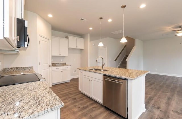 kitchen featuring a center island with sink, appliances with stainless steel finishes, white cabinetry, pendant lighting, and a sink